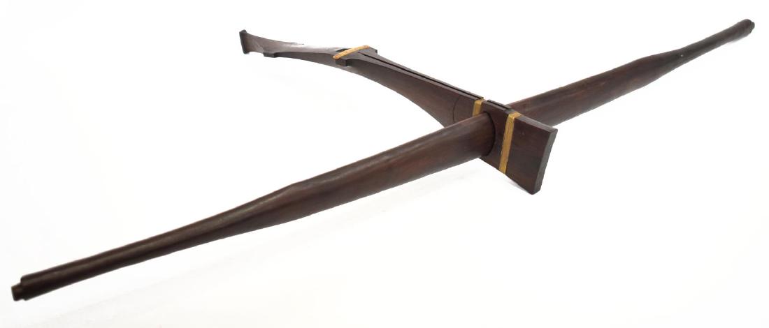 MONTAGNARD ROSEWOOD CROSSBOW: Rosewood crossbow, likely Montagnard, Central, Highlands, Vietnam, the bow 38.25" long, the 19" stock with ox bone release, the bow receiver wrapped at each side with reinforcing wire, total: 1.5lbs S