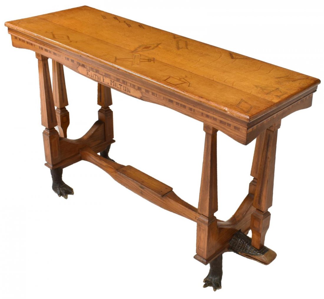 HOMAGE TO LINDBERGH, 1927 FOLK ART ALLIGATOR TABLE: Folk Art oak console table, early 20th c., the rectangular top inlaid with an early airplane, floral vases and geometric forms, the inverted arch frieze carved at one side "Ruth E. Milton" the opposit