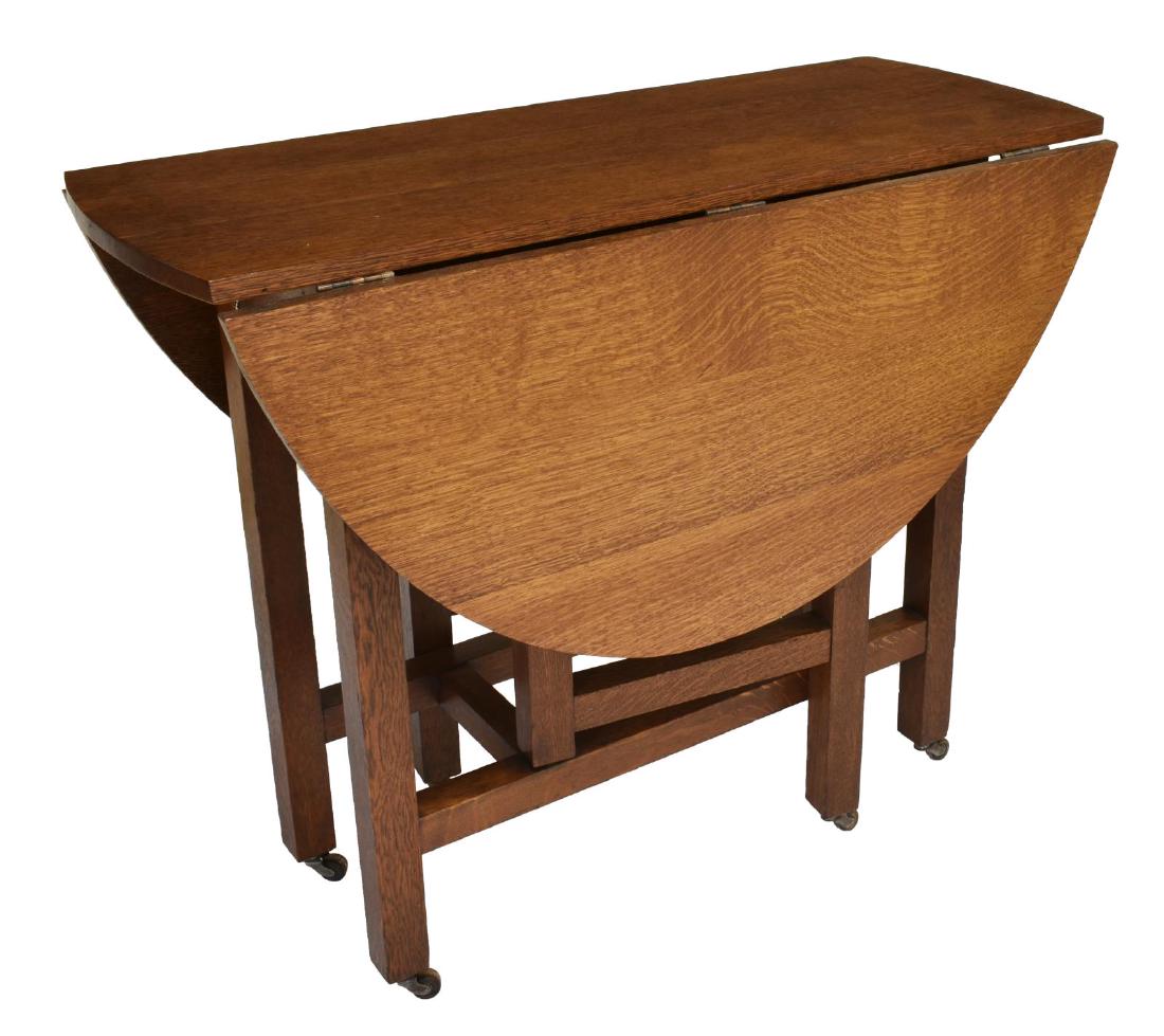 LIMBERT CRAFTSMAN OAK DROP LEAF TABLE, MODEL 180: Arts and Crafts oak drop-leaf table, early 20th c., Charles Limbert, Grand Rapids, Michigan, model 180, demilune drop leaves, forming oval tabletop, rising on stretcher-joined legs, gate legs swing to