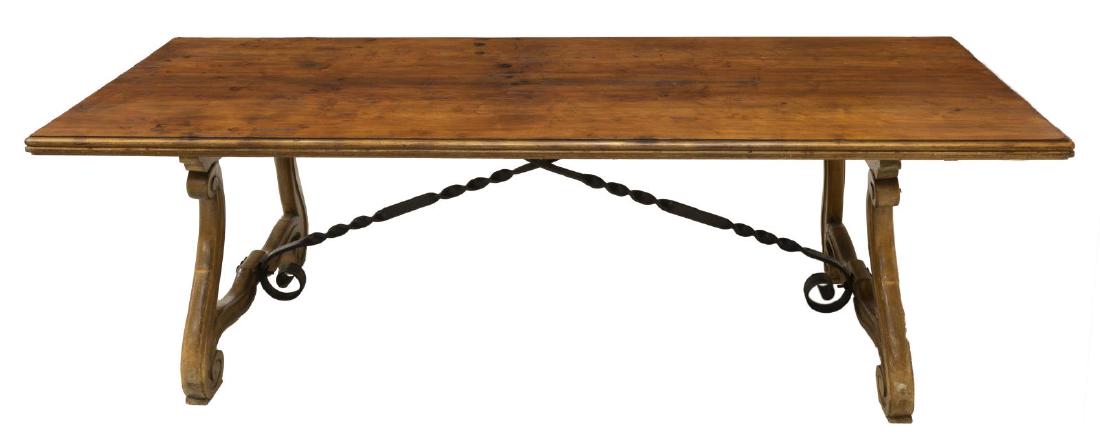 SPANISH BAROQUE STYLE DINING TABLE, 97"L: Spanish Baroque style dining table, 20th c., having rectangular top, on ox yoke trestle support, joined by decorative scrolled iron stretcher, approx 30"h, 97"w, 37"d Start Price: $200.00