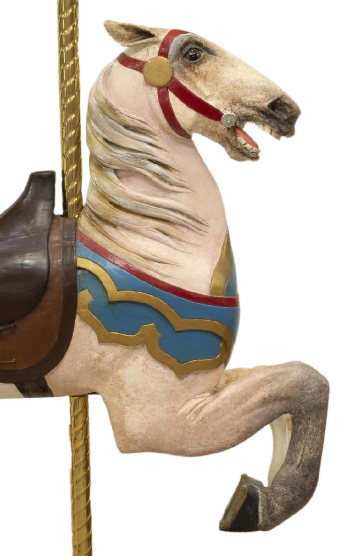STEIN & GOLDSTEIN CAROUSEL OR BARBER CHAIR HORSE: Inside row jumper carousel horse/ barber chair horse, Stein and Goldstein, first quarter 20th c., carved and painted wood, tucked head with ears back, inset eyes, parcel gilt breast strap, saddle with