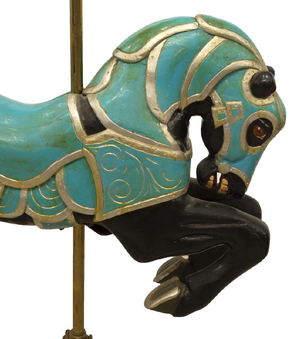 ISMAEL SERANO (ATTRIB) ARMORED CAROUSEL HORSE: Armored jumper carousel horse, attributed to Ismael Serrano (Mexico, 20th c.), mid to late 20th c., carved and painted wood, black horse, tucked head with ears pointed, two-tone painted armor, on adju