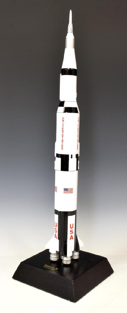 1/ 200 SCALE MODEL NASA ROCKET SATURN V: Scale model of NASA rocket Saturn V, 1/ 200 scale, presented on wood base, overall: approx 23.5"h, 6.75"w, 6.75"d, 2lbs Start Price: $50.00