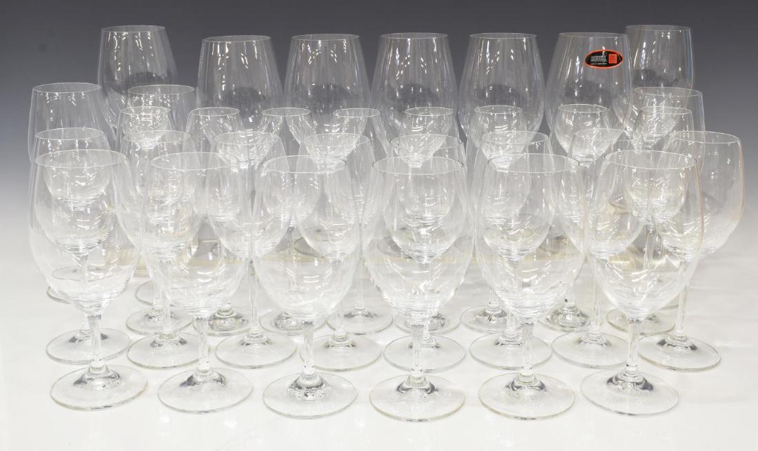 (32) RIEDEL COLORLESS GLASS STEMWARE GROUP: (lot of 32) Riedel colorless glass stemware, comprising: (8) champagne flutes, 8.5"h, (8) white wine glasses, 8"h, (8) red wine glasses, 8"h, (8) burgundy wine glasses, 9"h; acid etched mark underfoot