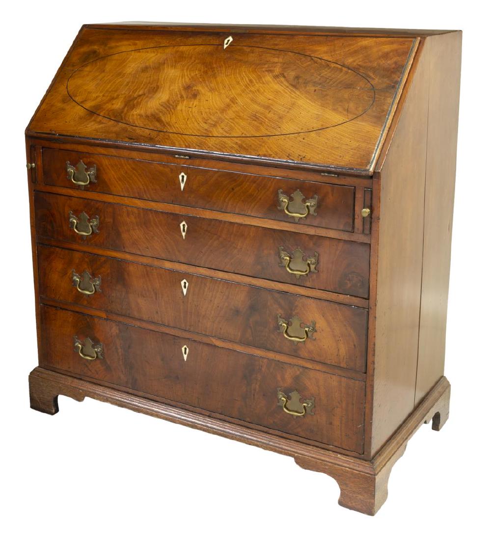 ENGLISH GEORGIAN SLANT-FRONT BUREAU DESK: English Georgian bureau desk, 19th c., slant-front desk with oval string inlay, opening to fitted interior gallery with small drawers and marquetry center door, over four drawers with batwing brasses 