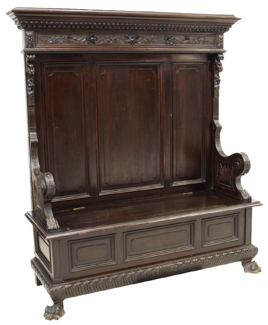 ITALIAN RENAISSANCE REVIVAL CARVED HALL BENCH: Italian Renaissance Revival carved hall bench, 19th c., having running ornamentation, foliate, floral, scrollwork, grotesque and dragon carving throughout, the hinged seat opening to interior storage,