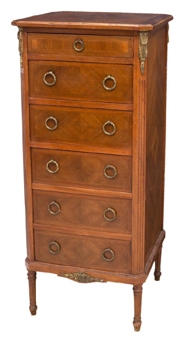 ITALIAN LOUIS XVI STYLE TALL CHEST OF DRAWERS: Italian Louis XVI style chest of drawers, 20th c., the upright case surmounted by a shaped top with molded edge, over six drawers, interior lined paper with fleur-de-lis design, each with ring handle 