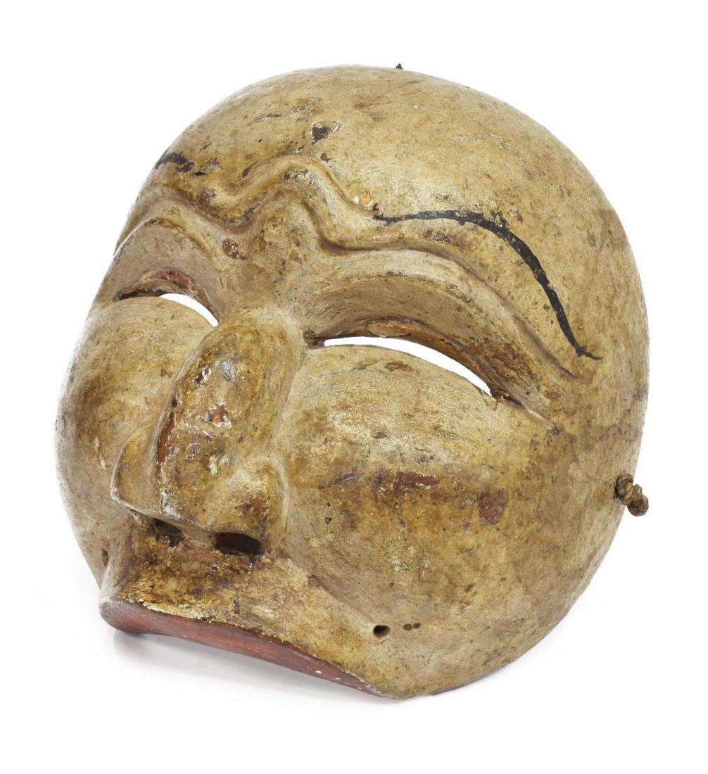 JAVANESE PAINTED WOOD DANCE HALF-MASK: Javanese painted wood dance half-mask, the grey-tone face with painted eyebrows, above partially closed eyes and nose, approx 6.25"h, 6"w, 4"d, 0.25lbs Start Price: $40.00