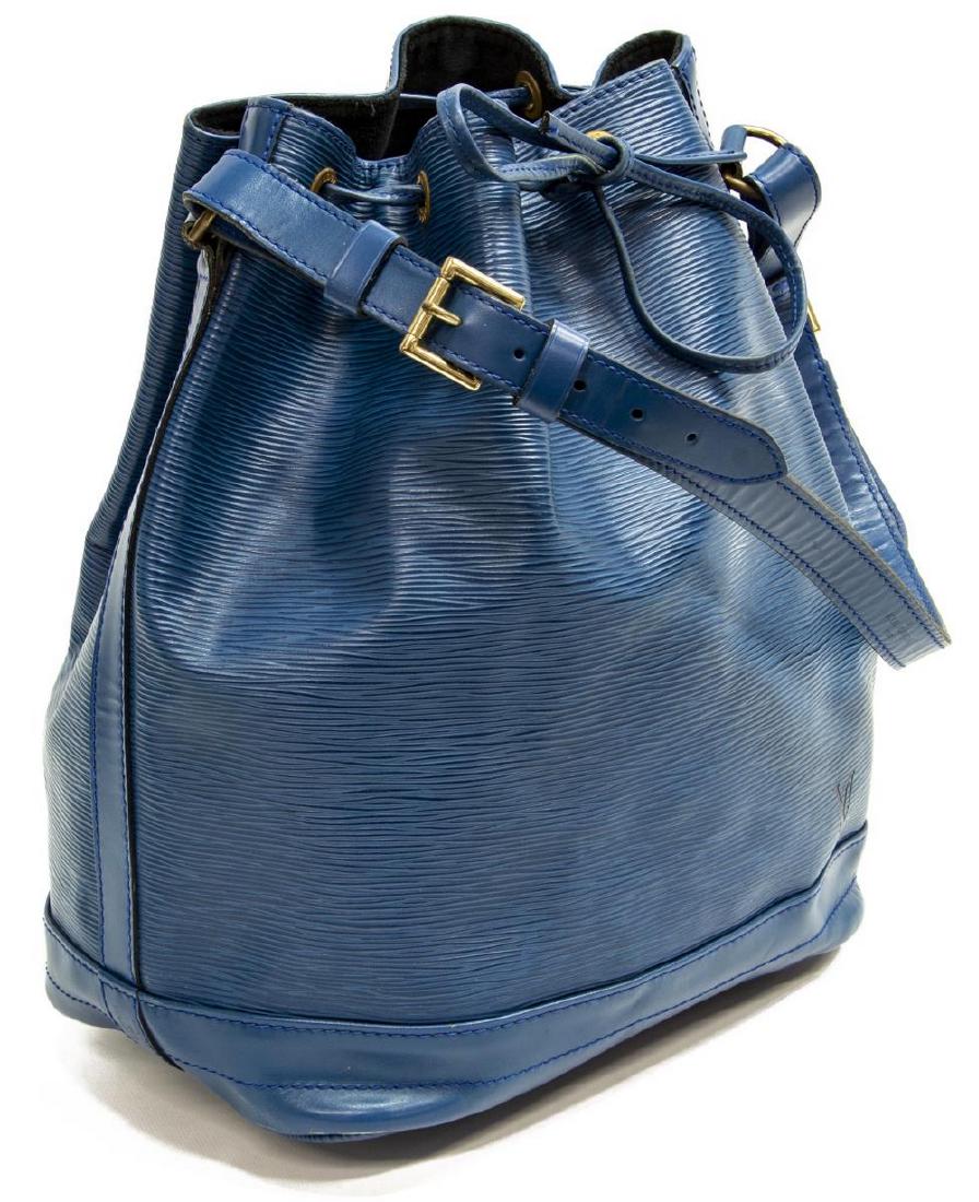 LOUIS VUITTON 'NOE PM' BLUE EPI LEATHER BUCKET BAG: Louis Vuitton "Noe PM" bucket bag, in blue Epi leather, with brass hardware, adjustable flat shoulder strap, drawstring closure at front face, creasing to the leather and patination to the hardware, m
