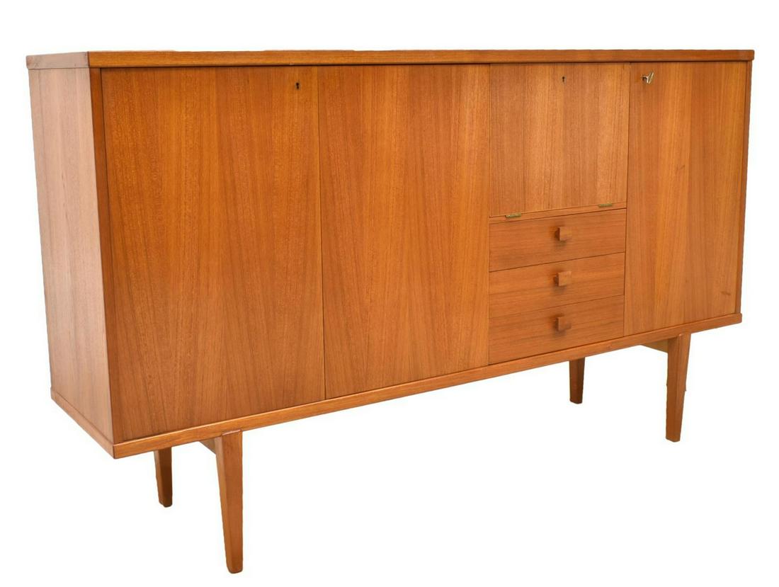 DANISH MID-CENTURY MODERN TEAK SIDEBOARD: Danish mid-century modern teak sideboard, c.1950s, having double-door cabinet to left side, opening to two shelves, center with drop front, interior fitted with single shelf and three drawers, single-