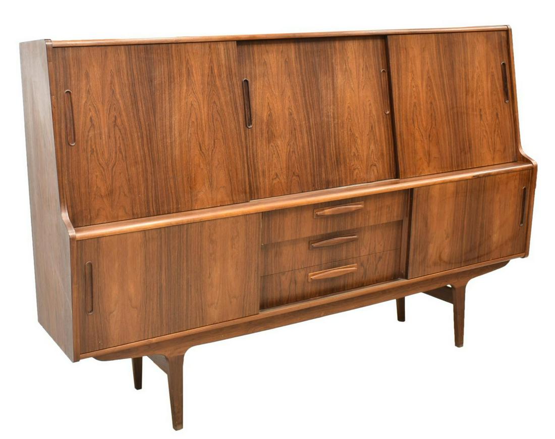 DANISH MID-CENTURY MODERN ROSEWOOD SIDEBOARD: Danish mid-century modern rosewood sideboard, c.1960s, three sliding door cabinets at top, the left and right each opening to single shelf, the center fitted with two shelves, lower case having slidin