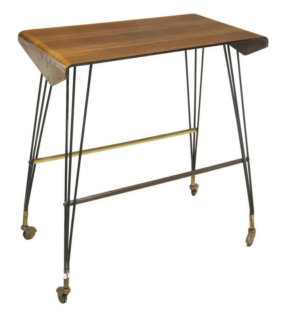 ITALIAN MID-CENTURY MODERN ROLLING SERVICE CART: Italian mid-century modern rolling service cart, c.1950s-1960s, bentwood veneered top, rising on black iron legs, joined by parcel gilt metal stretchers, all moving on wheels, some raised and loss of