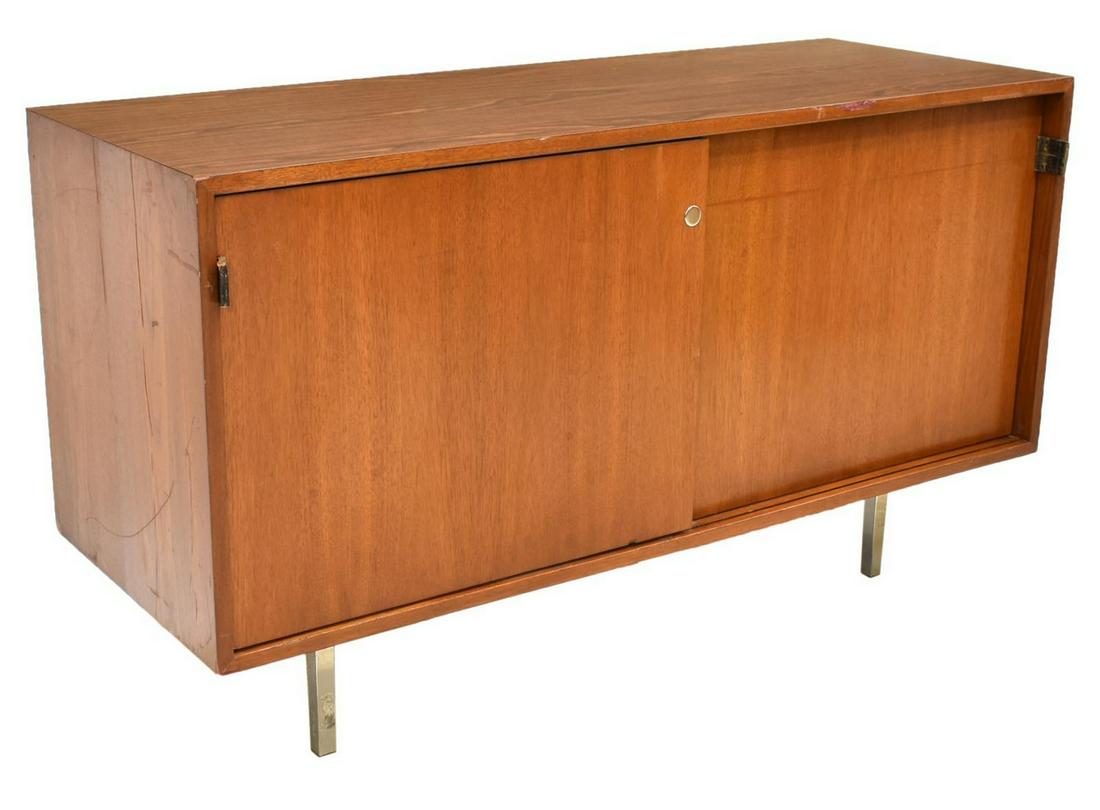 FLORENCE KNOLL MID-CENTURY FILE CREDENZA: Mid-century modern credenza, c.1980, designed by Florence Knoll (United States, 1917-2019) for Knoll International, the rectangular case having dual sliding doors with leather tab pulls, opening to in