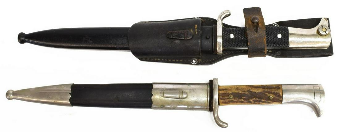 (2) GERMAN K98 PARADE BAYONETS, 1935 FROG, POLICE: (lot of 2) Vintage German K98 carbine bayonets, (1) bright 8.5" unmarked blade with light cosmoline, a black handle with bird head pommel, housed in black metal scabbard and leather frog marked at the