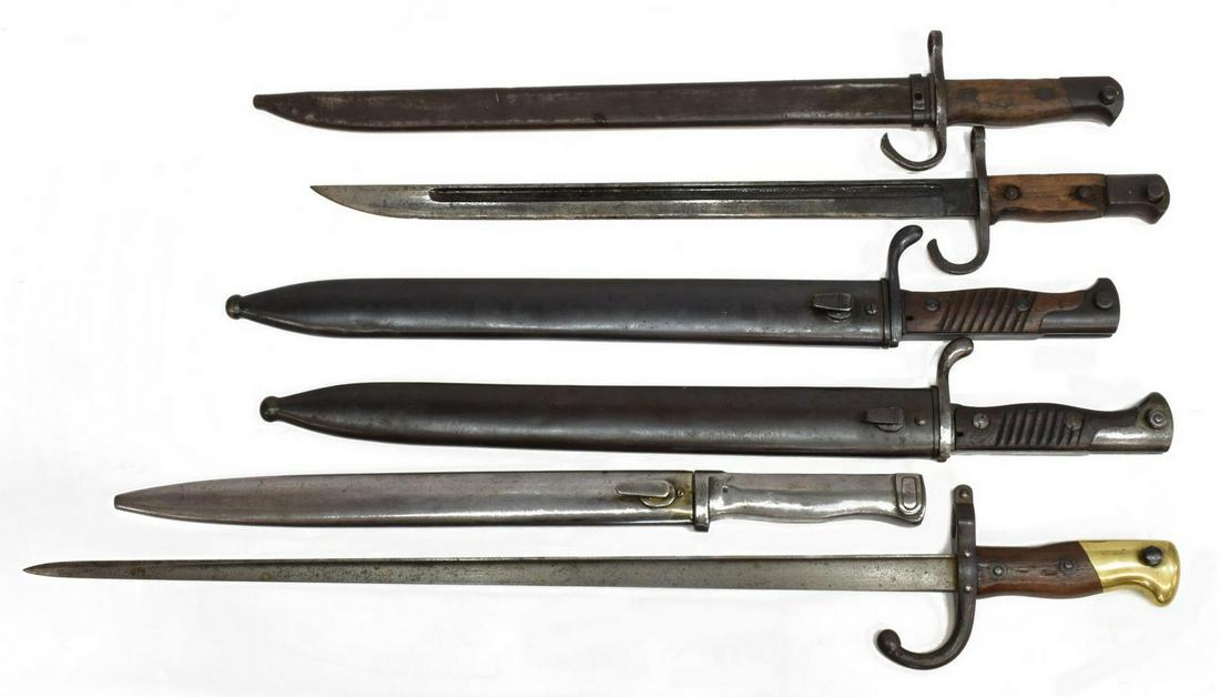 (6) BAYONETS, GERMAN, JAPANESE, FRENCH: (lot of 6) Bayonets: (1) French 1874 bayonet, the 20.5"l blade marked at the ricasso diamond with B (controller mark) and M within circle, the spine Saint Ã‰tienne, 1877, lacking scabbard, overall:
