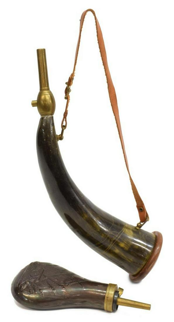 (2) ANTIQUE STYLE POWDER FLASK / HORN REPLICAS: (lot of 2) Powder flask replicas: (1) having embossed design of crossed rifles and revolvers above the stand of flags pattern with cannon, straight spout marked Made in Italy; (1) horn with brass char