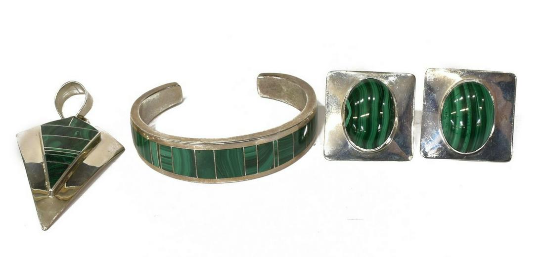 4) NAVAJO TRACEY KNIFEWING STERLING JEWELRY SUITE: (lot of 4) Native American jewelry suite, Tracey Knifewing, Navajo, executed in sterling silver and malachite, comprising: (1) cuff bracelet, 2.25"w (interior), (1) shaped pendant, approx 2.75"l, (pai