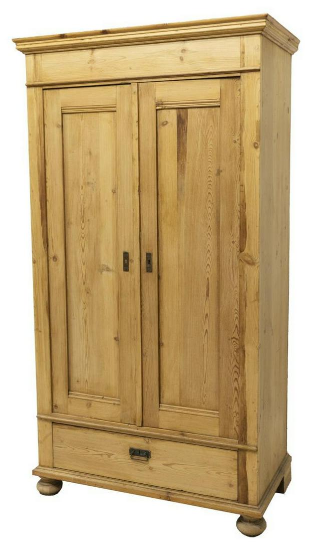SCANDANAVIAN PINE CUPBOARD ON BUN FEET, 19TH C.: Scandinavian pine armoire / cabinet, late 19thc., having a stepped cornice over two cabinet doors, open interior, above a single drawer, rising on bun feet, approx 75"h, 41"w, 21.5"d Start Price: $300