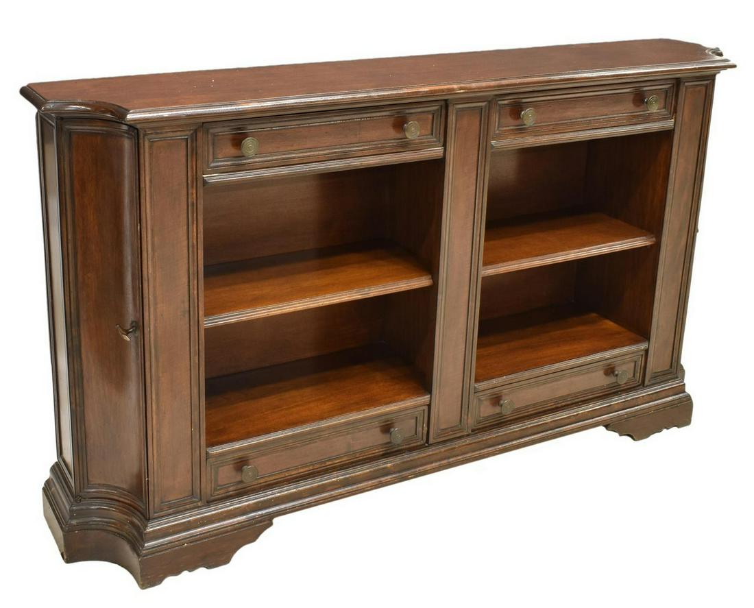 RENAISSANCE REVIVAL OPEN CONSOLE BOOKCASE: Tuscan Renaissance Revival walnut open bookcase, 20th c., the shaped top over two drawers above the divided bookcase section, flanking curved front doors at each side, rising on the stepped conforming