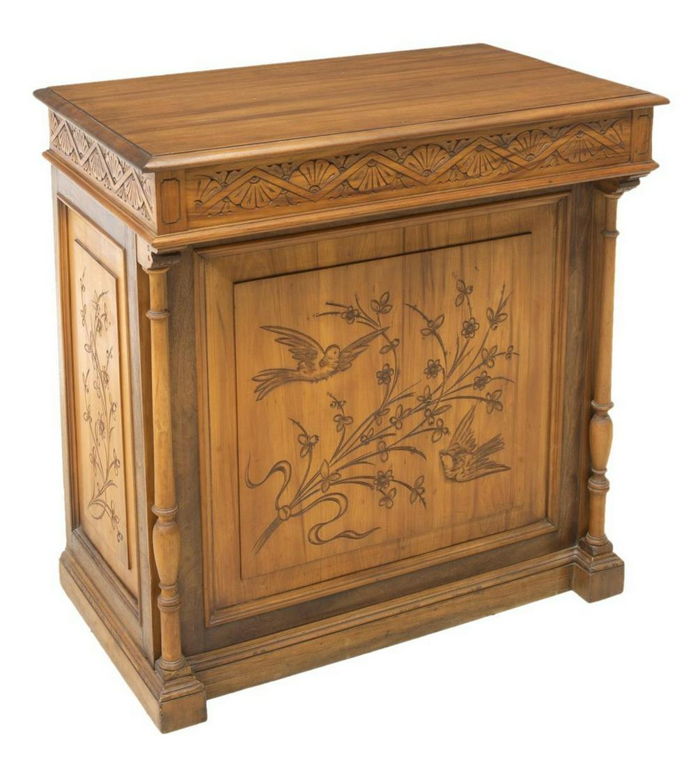 AESTHETIC MOVEMENT WALNUT CLERK'S DESK: Aesthetic Movement walnut clerk's desk, late 19th c., having single frieze drawer over kneehole, carved fan frieze, paneled sides and back with stylized floral and bird carvings, flanked by turned col