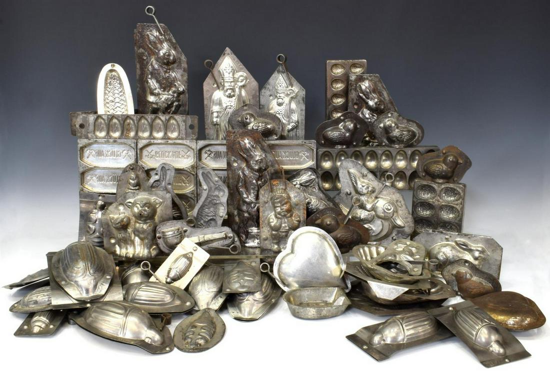 (LOT) COLLECTION VINTAGE CHOCOLATE & CANDY MOLDS: (lot) Substantial collection of vintage metal chocolate and candy molds, various sizes and figural designs, highlights include animal form, seashell and scarab, etc., wear/oxidation with age and use, 