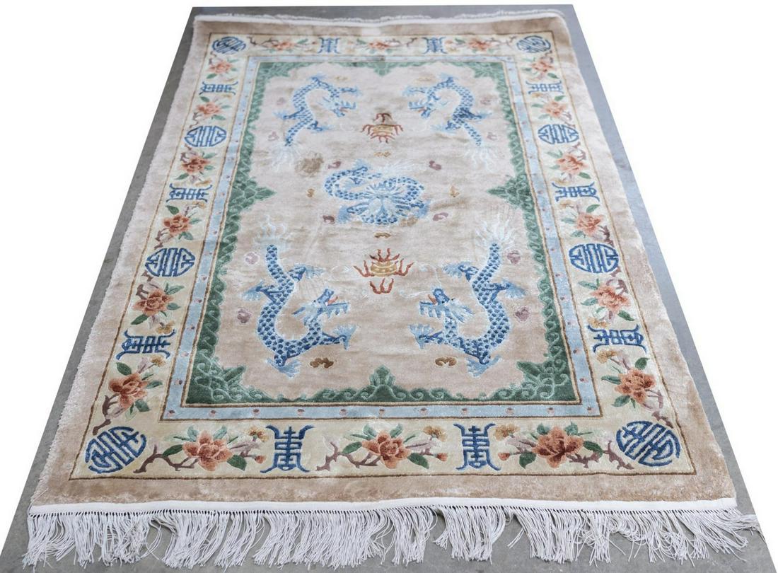 CHINESE SCULPTED DRAGON RUG, 6'2" X 4'0": Chinese sculpted rug, machine made, the center decorated with blue dragons, encased by a border of floral motifs and auspicious characters, approx 6'2"l, 4'0"w **Provenance: from a private Austin, Tex