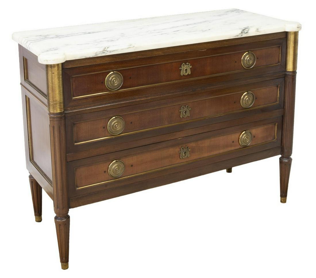 FRENCH LOUIS XVI STYLE MARBLE-TOP MAHOGANY COMMODE: French Louis XVI style mahogany commode, 20th c., white marble top with rounded front corners, over corresponding case fitted with three drawers, fluted corner posts continuing into tapered legs, endi