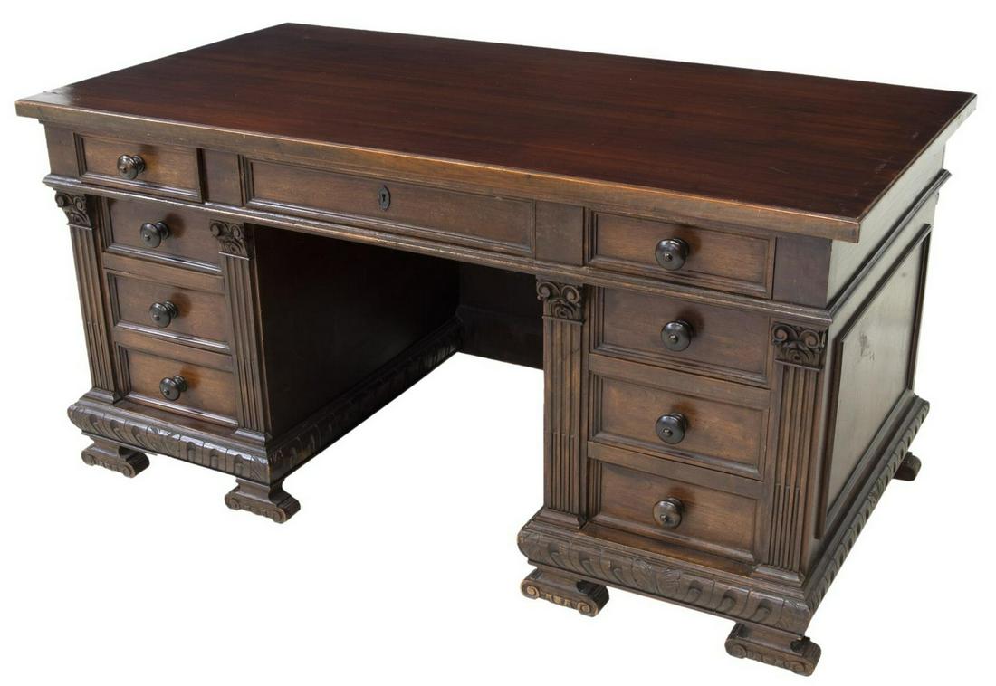 RENAISSANCE REVIVAL KNEEHOLE WRITING DESK: Renaissance Revival double pedestal kneehole writing desk, 19th c., having a rectangular top, nine drawers, a carved skirt over volute supports, scratches at top, approx 31"h, 63"w, 33"d Start Price: 