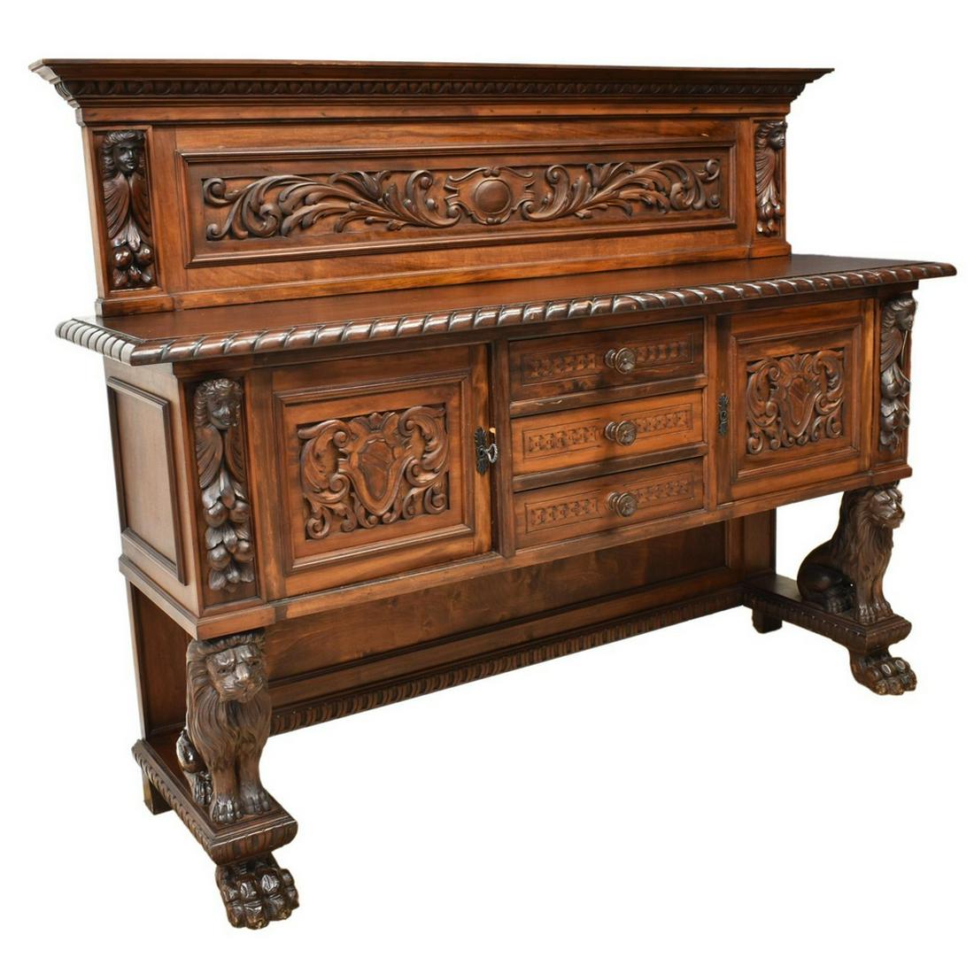ITALIAN RENAISSANCE REVIVAL WALNUT LION SIDEBOARD: Italian Renaissance Revival walnut sideboard, 20th c., having raised back with cornice top, egg and dart molding, back panel with figural masks centering cartouche shield and scrolling foliates, lower