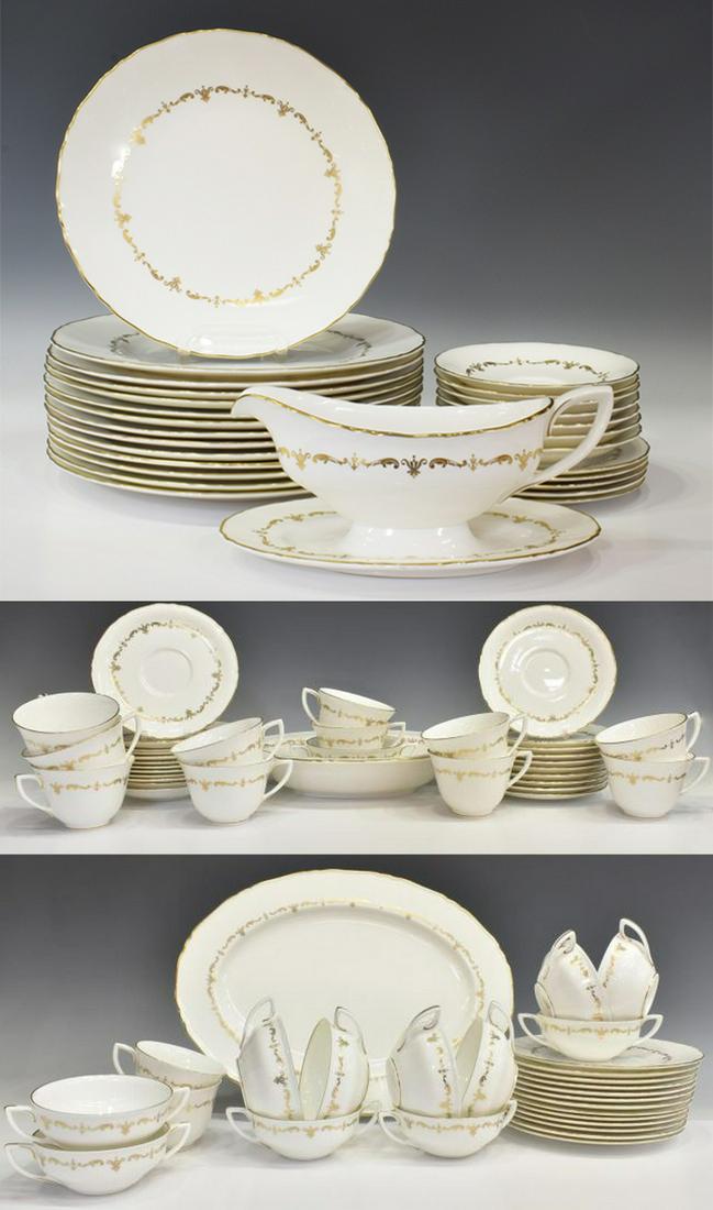 89) ROYAL WORCESTER GOLD CHANTILLY PARTIAL SERVICE: (lot of 89) Royal Worcester bone china dinner service, England, in the "Gold Chantilly" pattern, the white ground decorated by gilt scrolling foliate design and rim, with scalloped edge, comprising: (