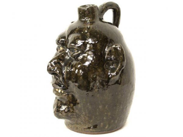LANIER MEADERS GEORGIA FOLK ART POTTERY FACE JUG: Lanier Meaders (White County, Georgia, 1917-1998) stoneware face jug in a rich glaze, signed and incised 65, 9.5"h x 8.5"w x 8"d
