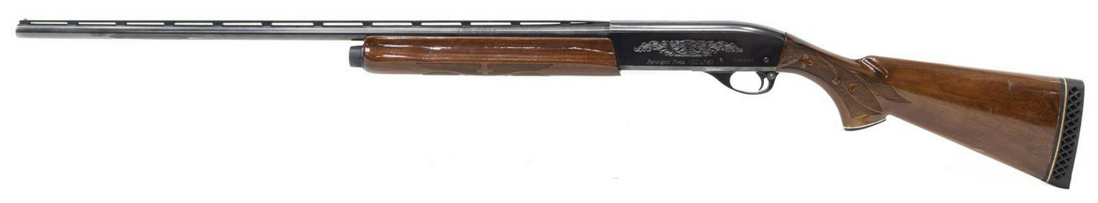 REMINGTON MODEL 1100 LT 20 GAUGE SHOTGUN, AUTOLOAD: Remington Model 1100LT-20 shotgun, 20 gauge, auto load, 27.5" vent rib barrel, 2.75" shells, foliate engraving at receivers and bolt, checkered hardwood stock, SN N523XXXK Start Price: $300.00