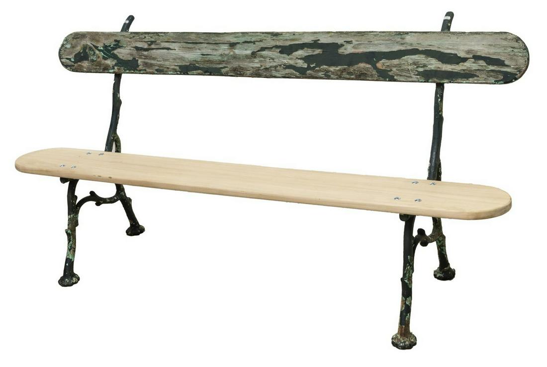 FRENCH CAST IRON GARDEN PARK BENCH: French cast iron garden bench, early 20th c., having green painted cast iron base, high plank back, later seat, rising on four legs joined by side stretchers, approx 30.5"h, 66.20"w, 17.75"d Start Pri