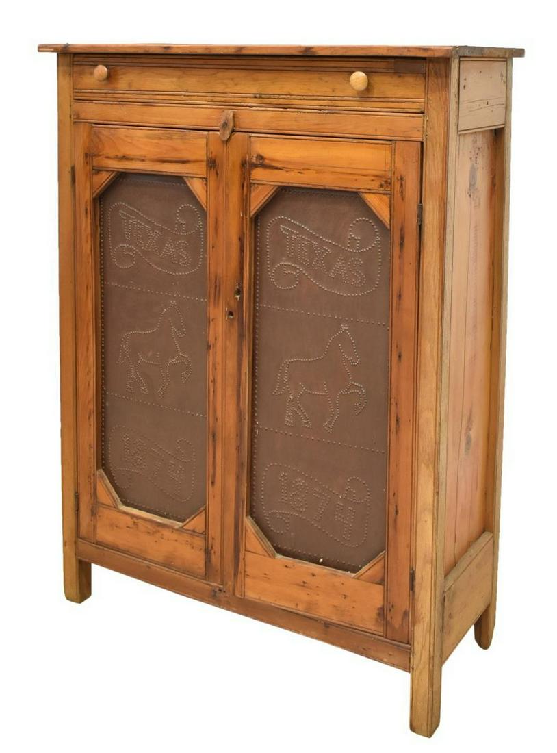 AMERICAN PRIMITIVE PUNCHED PANELS PIE SAFE CABINET: American Primitive mixed wood pie safe, 19th c., fitted with single drawer over double doors with later inset punched metal panels, panels decorated with horse flanked by banners reading 'Texas' and '