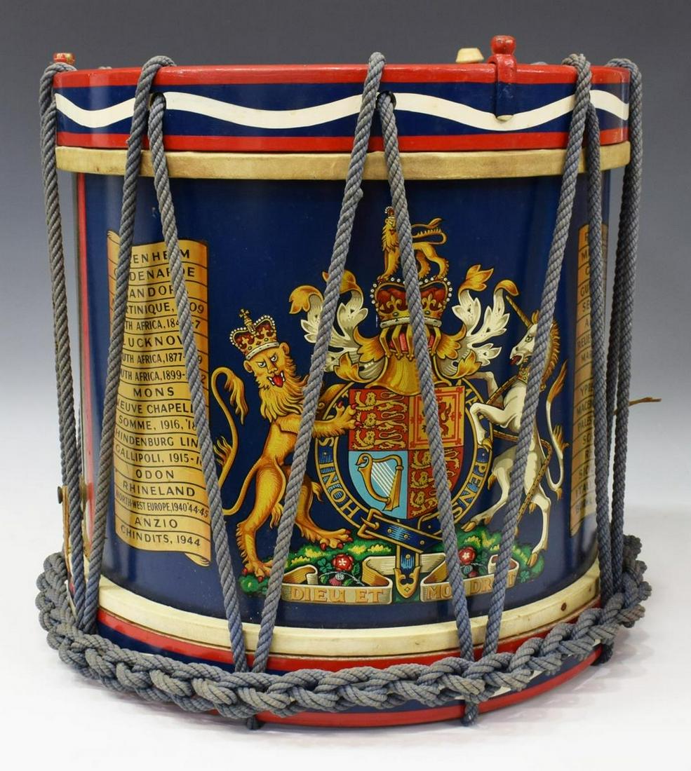 BRITISH POLYCHROME BRASS MILITARY DRUM: British polychrome wood and brass military drum, George Potter & Co, Aldershot, 20th c., having wood ring around drum head and base, the brass body encased by rope accent, painted with the United King