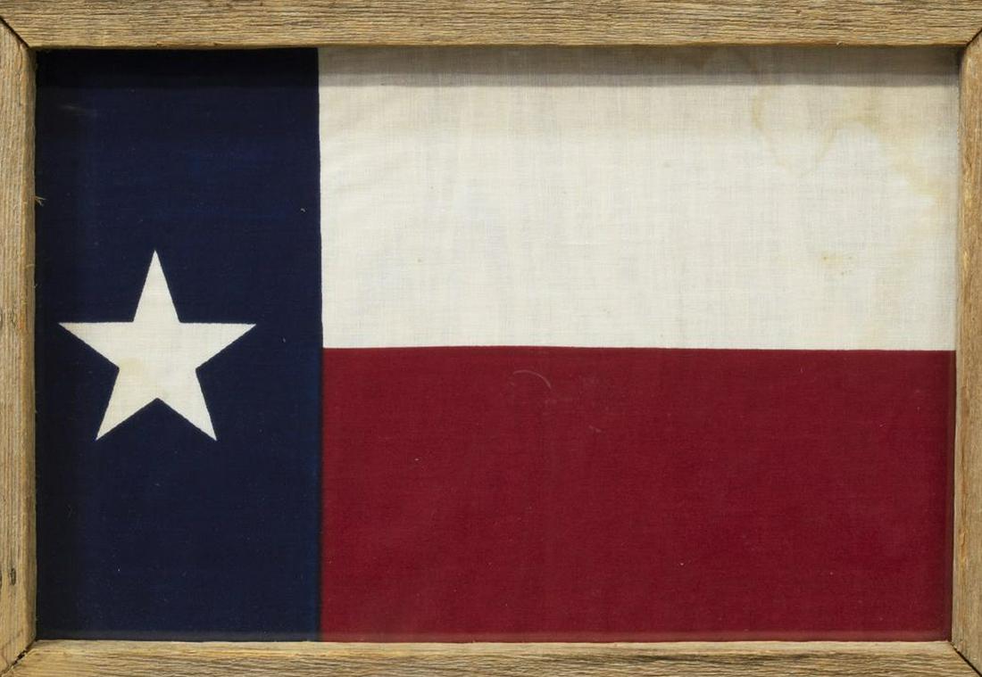 RUSTIC FRAMED TEXAS STATE LONE STAR FLAG: Framed Texas state flag, centered in rustic pine frame, sight: approx 10.25"h, 16.25"w, overall: approx 18"h, 24"w, 6.5lbs Start Price: $50.00