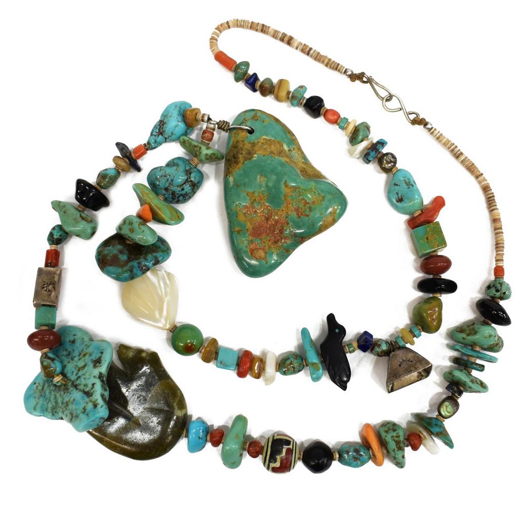 NATIVE AMERICAN TURQUOISE BEADED NECKLACE: Native American necklace, with a variety of turquoise, coral, spiny oyster shell, and mother of pearl beads, accented with bear and bird stone fetish beads, silver (content unknown) bell, central larg