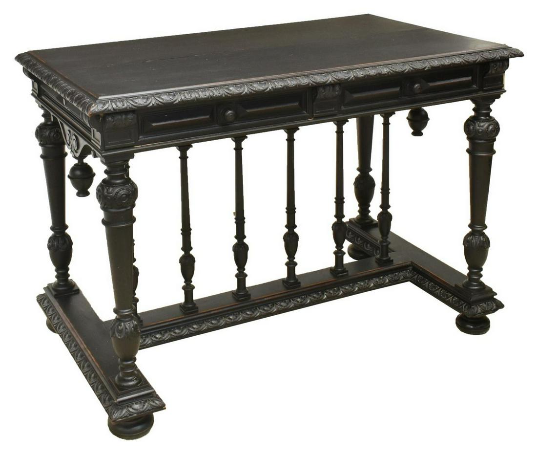 FRENCH RENAISSANCE REVIVAL EBONIZED DESK TABLE: French Renaissance Revival ebonized desk, mid 19th c., rectangular top over two drawers, rising on carved tapered supports, joined by cross stretcher with six central columns, on bun feet, approx 29.5