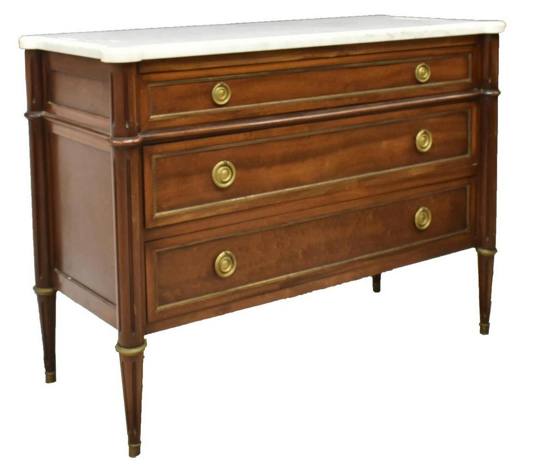 FRENCH LOUIS XVI STYLE MARBLE-TOP MAHOGANY COMMODE: French Louis XVI style marble-top mahogany commode, late 19th c., the marble top resting on case fitted with three drawers, accented by gilt metal elements, rising on fluted tapered legs, approx 34.5"