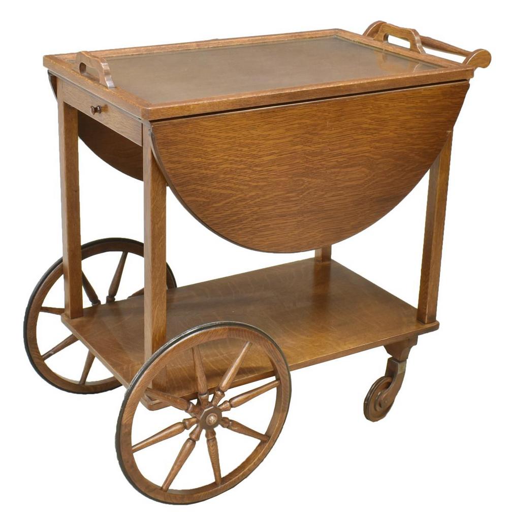 AMERICAN PAALMAN OAK TRAY-TOP TEA TROLLEY CART: American oak tea trolley, Paalman Furniture Co., mid 20th c., removable tray top, demilune drop sides, single frieze drawer, turned handle to one side, straight supports joined by lower tier, on spoke