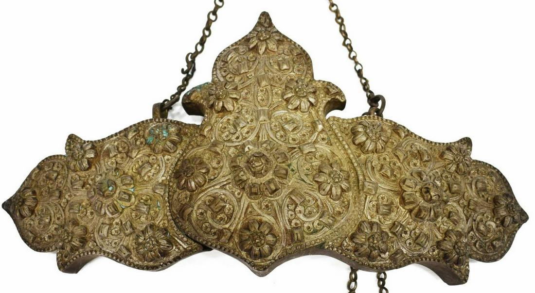 ORNATELY WORKED SILVER BELT BUCKLE: Large silver (content unknown) belt buckle, possibly from the Caucasian region/ Central Asia, with raised floral motif, pin closure, approx 3.5"h, 7"l, 235.5 grams Start Price: $50.00