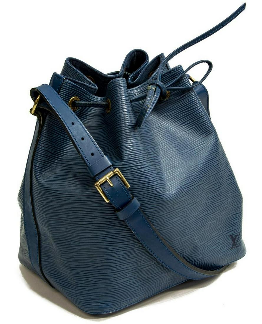 LOUIS VUITTON 'NOE PM' BLUE EPI LEATHER BUCKET BAG: Louis Vuitton "Noe PM" bucket bag, in blue Epi leather, with brass hardware, adjustable flat shoulder strap, drawstring closure at front face, creasing to the leather, leather on drawstring has come a