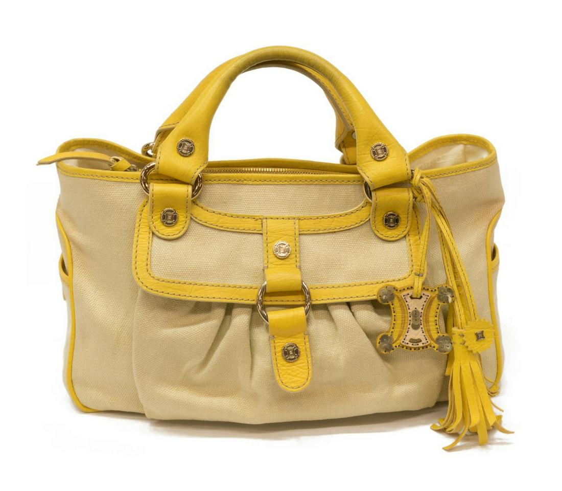 CELINE 'BOOGIE BAG' IN LEATHER & IVORY CANVAS: Celine "Boogie Bag Front Pocket", in ivory woven canvas, with gold-tone hardware, leather trim, dual rolled handles, open at top, exterior storage pocket with flap and two side pockets, sectioned logo