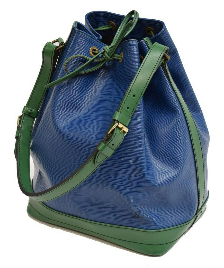 LOUIS VUITTON 'NOE' BICOLOR EPI LEATHER BUCKET BAG: Louis Vuitton "Noe" bucket bag, in bicolor blue and green Epi leather, with brass hardware, single flat adjustable shoulder strap, black Alcantara lining, single zipper pocket at interior wall, drawst
