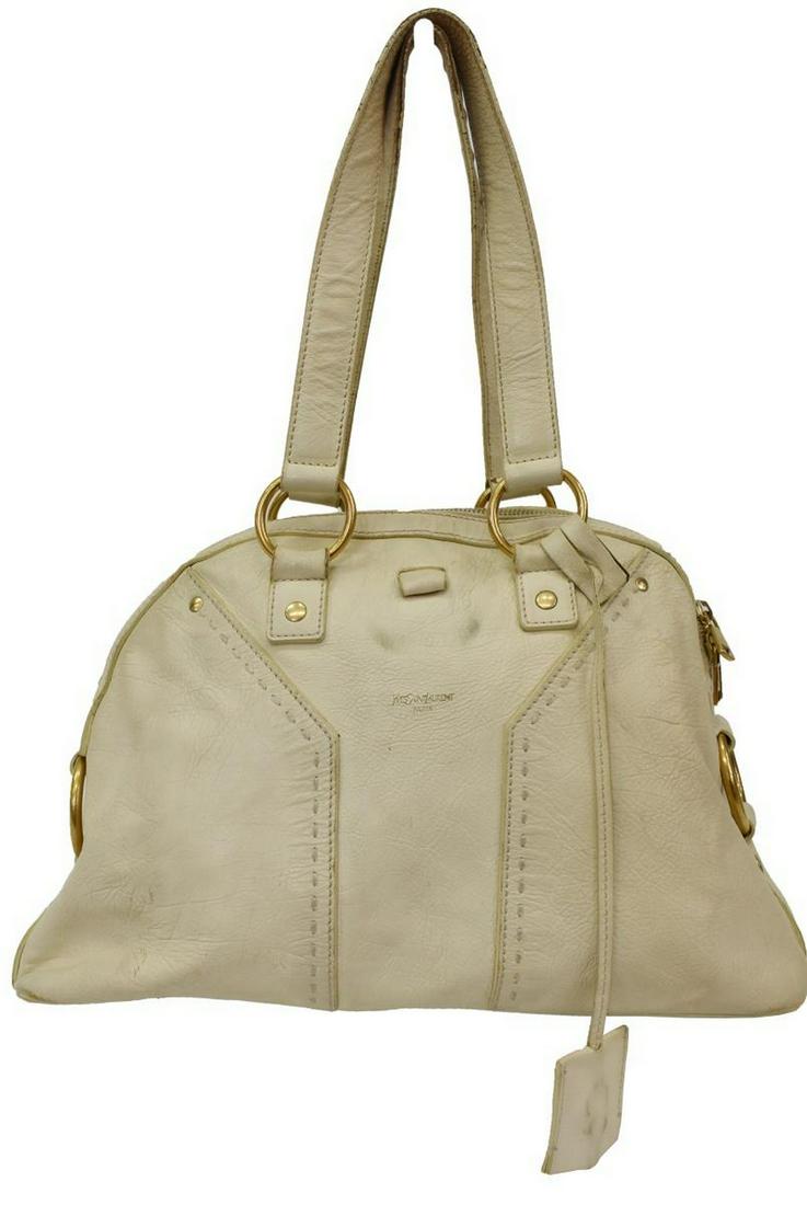 YVES ST. LAURENT TAN SHOULDER BAG: Yves Saint Laurent shoulder bag, in off-white leather, gold-tone hardware, dual flat shoulder straps at top, zip closure at top opening to black lined interior, single zipper pocket to interior wall, 