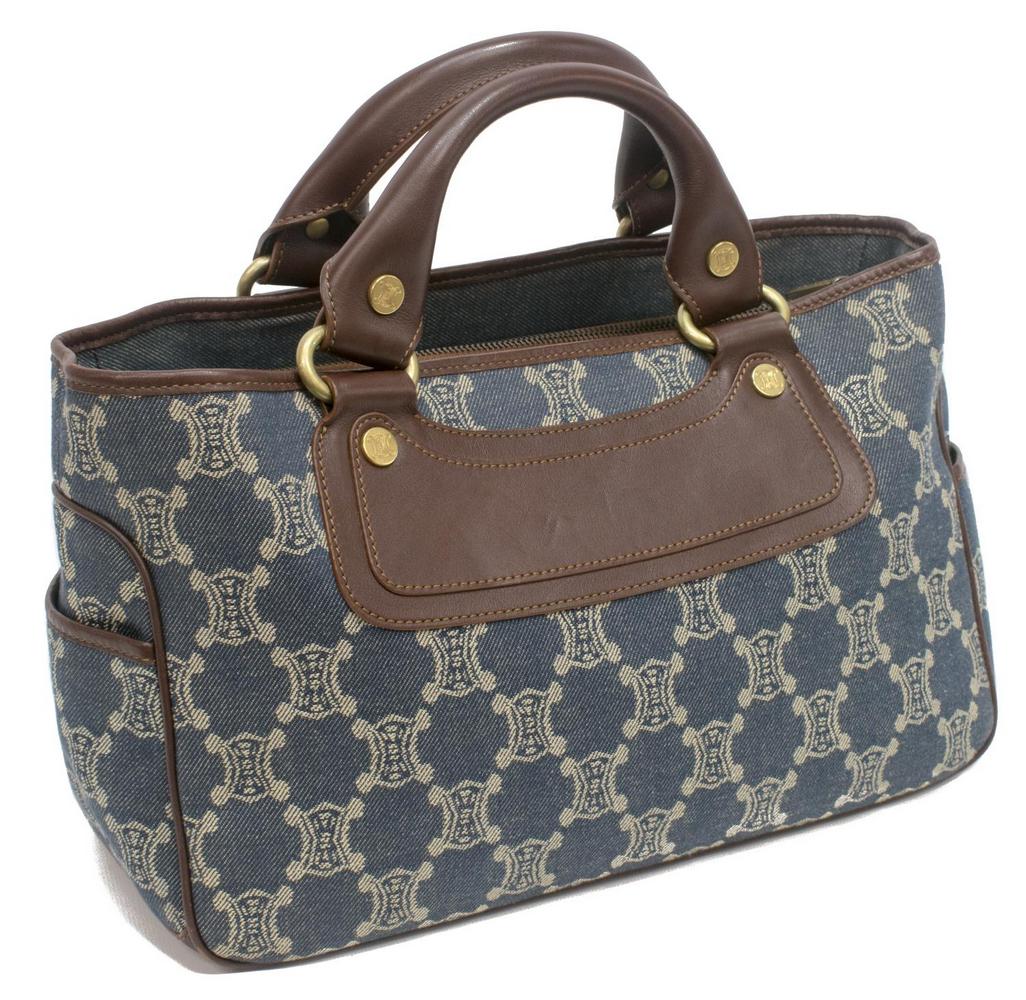 CELINE BLUE DENIM MACADAME CANVAS "BOOGIE" BAG: Celine "Boogie" bag in blue Macadame denim canvas, brown leather trim and handles with brushed gold tone metal hardware, each end with slotted pocket, sectioned interior with central zipped storage, l