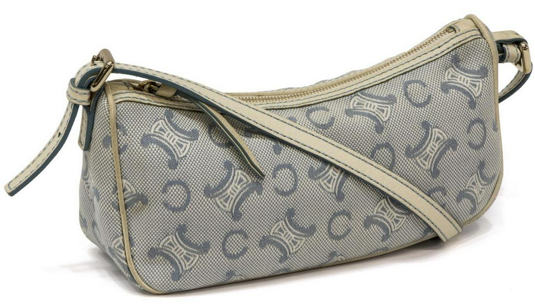 CELINE LIGHT BLUE CANVAS MONOGRAM HANDBAG: Celine light blue canvas monogram handbag, white leather shoulder strap and trim with blue stitching above zip closure, interior lined with pinstripe lining, having one interior slot pocket, some disc