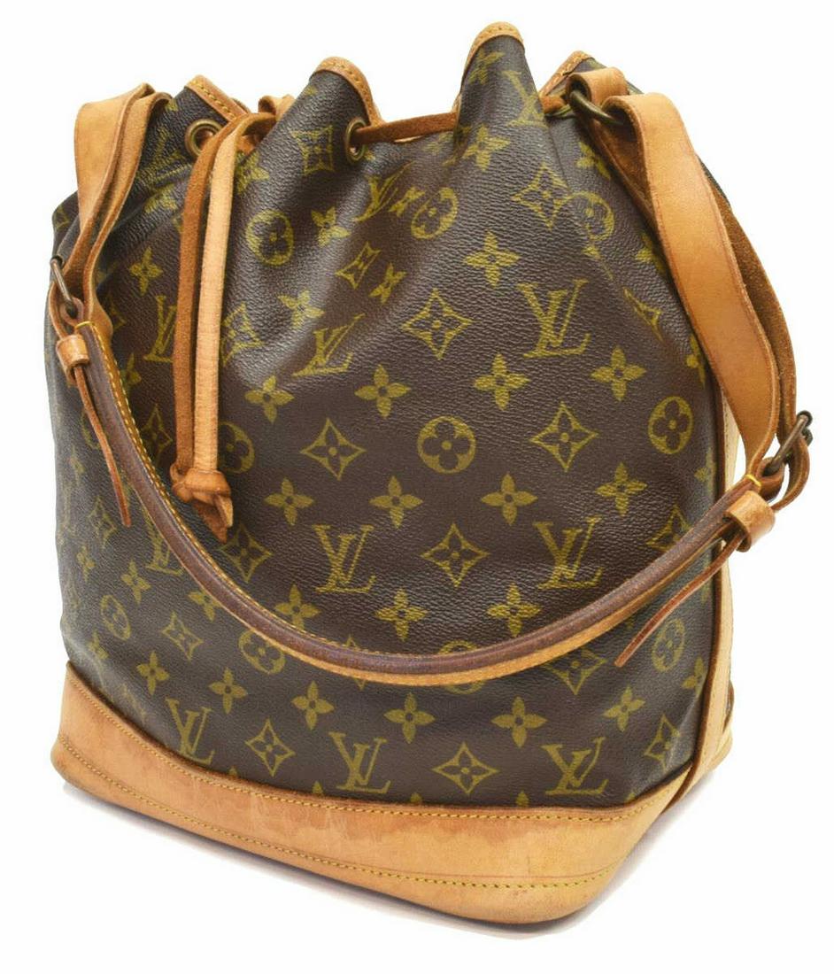 LOUIS VUITTON 'NOE' MONOGRAM CANVAS BUCKET BAG: Louis Vuitton "Noe" bucket bag, in brown and tan monogram coated canvas, with brass hardware, tan vachetta leather trim, adjustable flat shoulder strap, drawstring closure at front face opening to bro