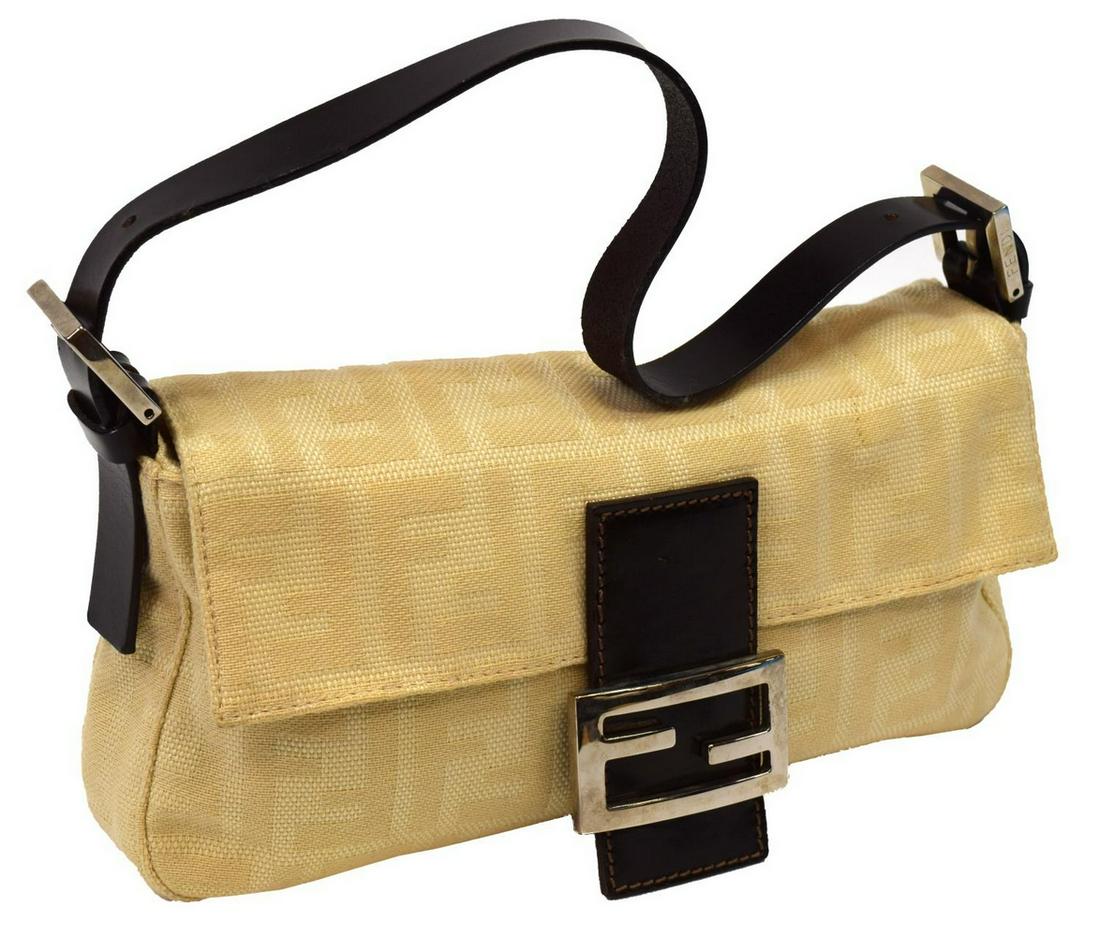 FENDI BEIGE MONOGRAM CANVAS BAGUETTE HANDBAG: Fendi beige monogram canvas baguette shoulder bag with dark brown adjustable strap, silver tone metal hardware and fold over logo snap closure, interior with dark brown interior, zipper pocket, dark m