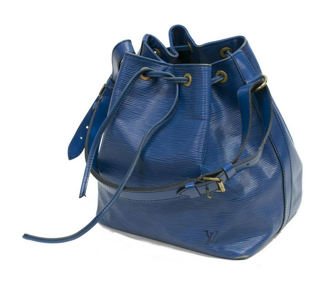 LOUIS VUITTON 'NOE' BLUE EPI LEATHER BUCKET BAG: Louis Vuitton "Noe," in blue Epi leather, with brass hardware, contrasting black stitching, single flat adjustable shoulder strap, black Alcantara lining, single zipper pocket at interior wall, drawst